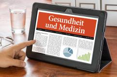 Zeigefinger tippt auf Tablet, auf dem Bildschirm ein Artikel zu "Gesundheit und Medizin"ur mit der Aufschrift "Gesundheit" wird mit Zeigefinger gedrückt